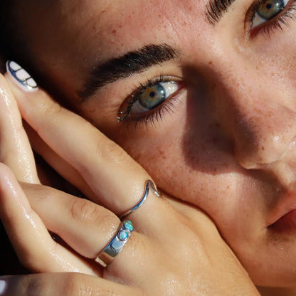 silver opal past present future ring worn by a woman showing beauty and elegance with ocean-inspired design