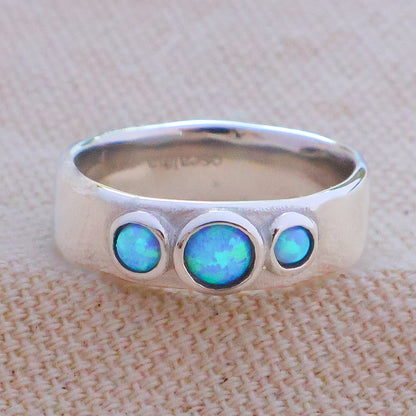 silver opal past present future ring featuring three vibrant opals on a polished silver band