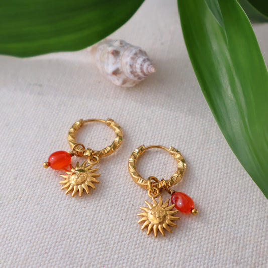 Gold earrings with red carnelian and sun charm